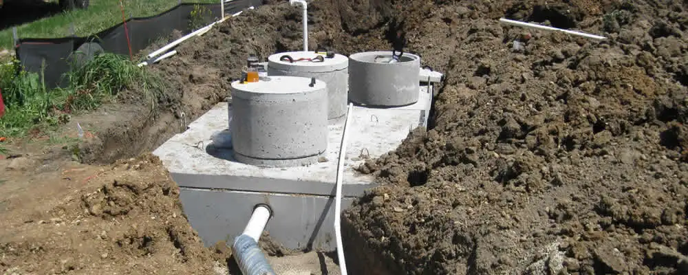 Septic system repair and installation site with tank access ports in Saint Louis, MO